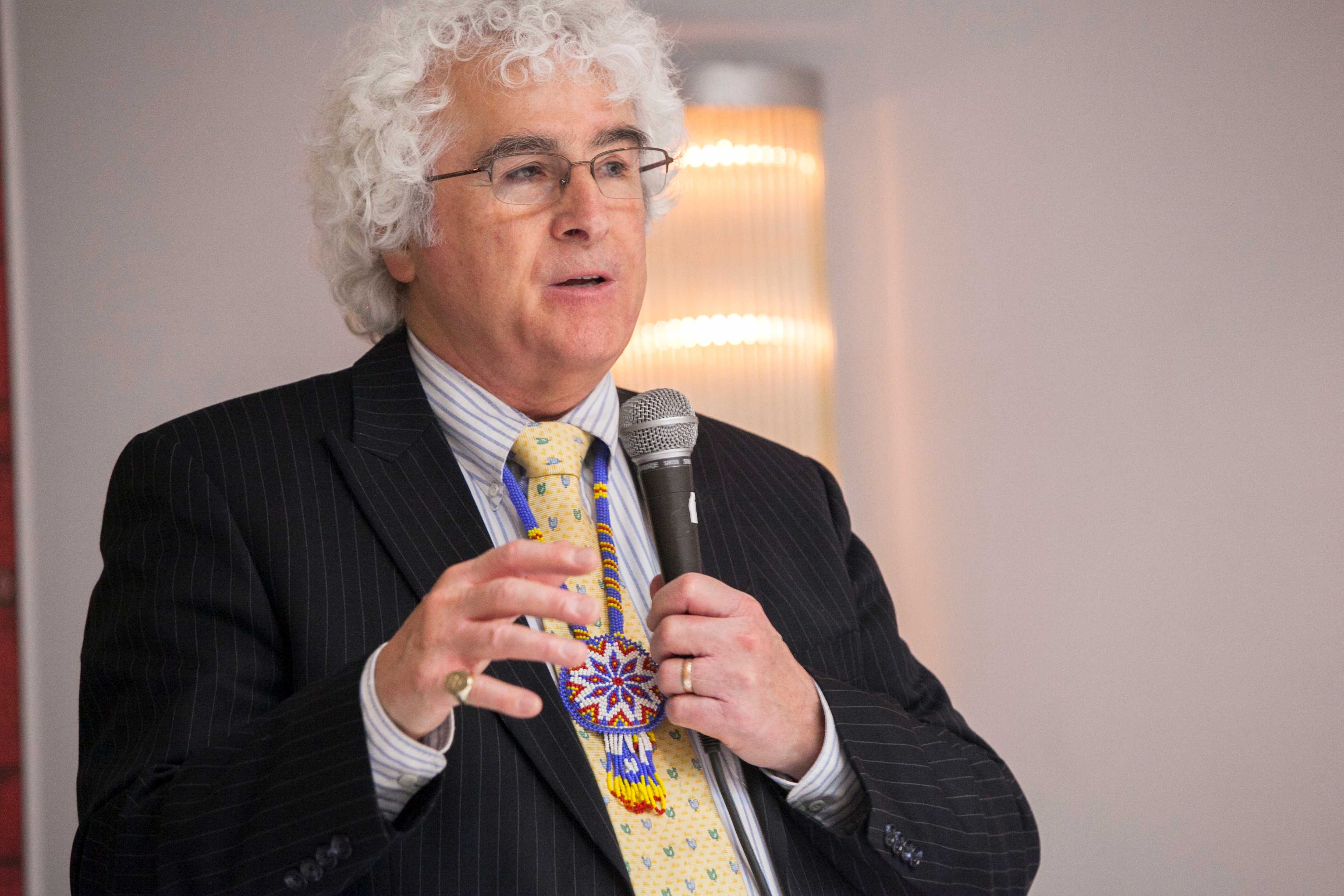 Danny Sheehan speaking into a microphone
