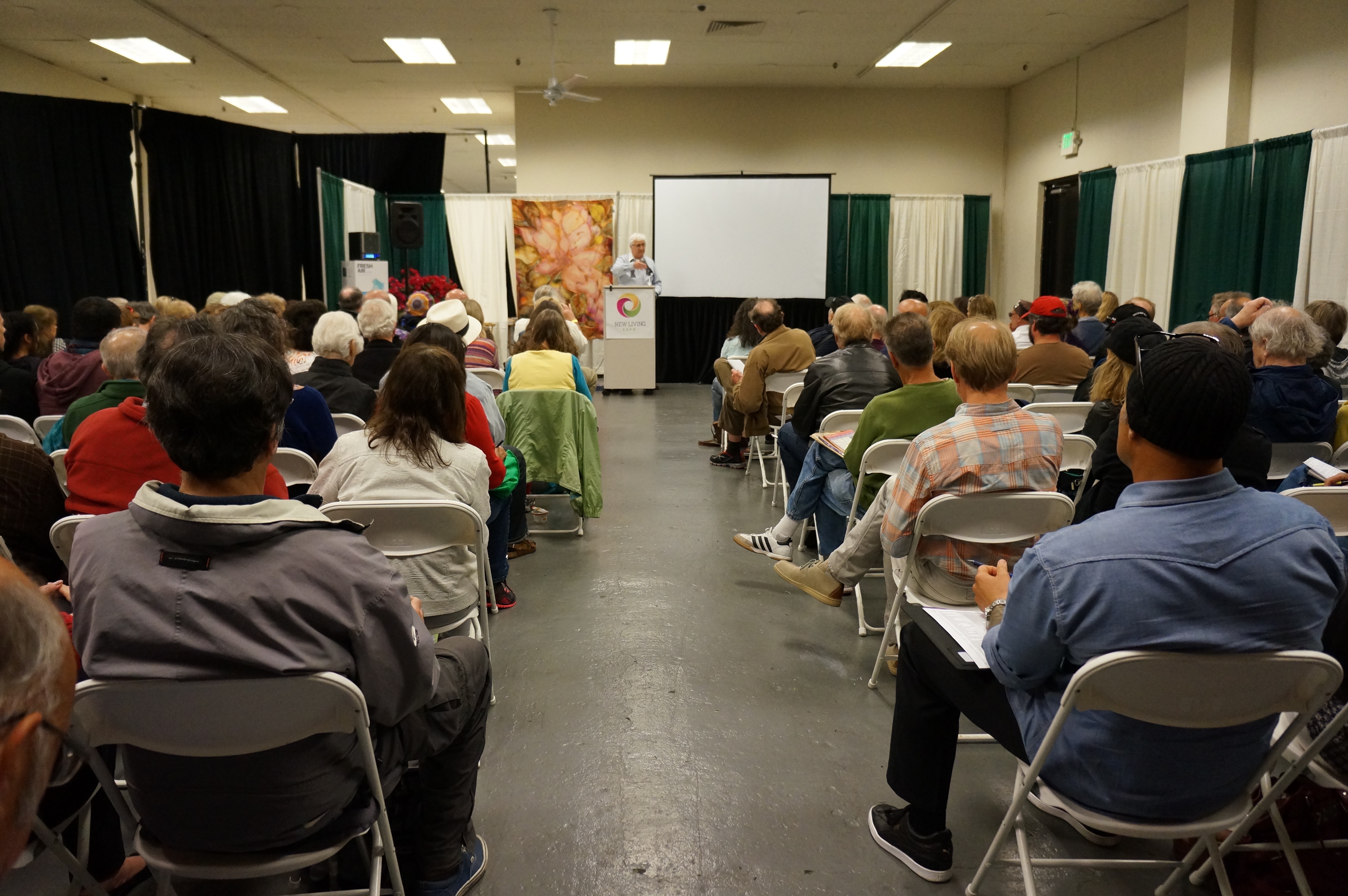 A lecture hall audience listening to Danny Sheehan