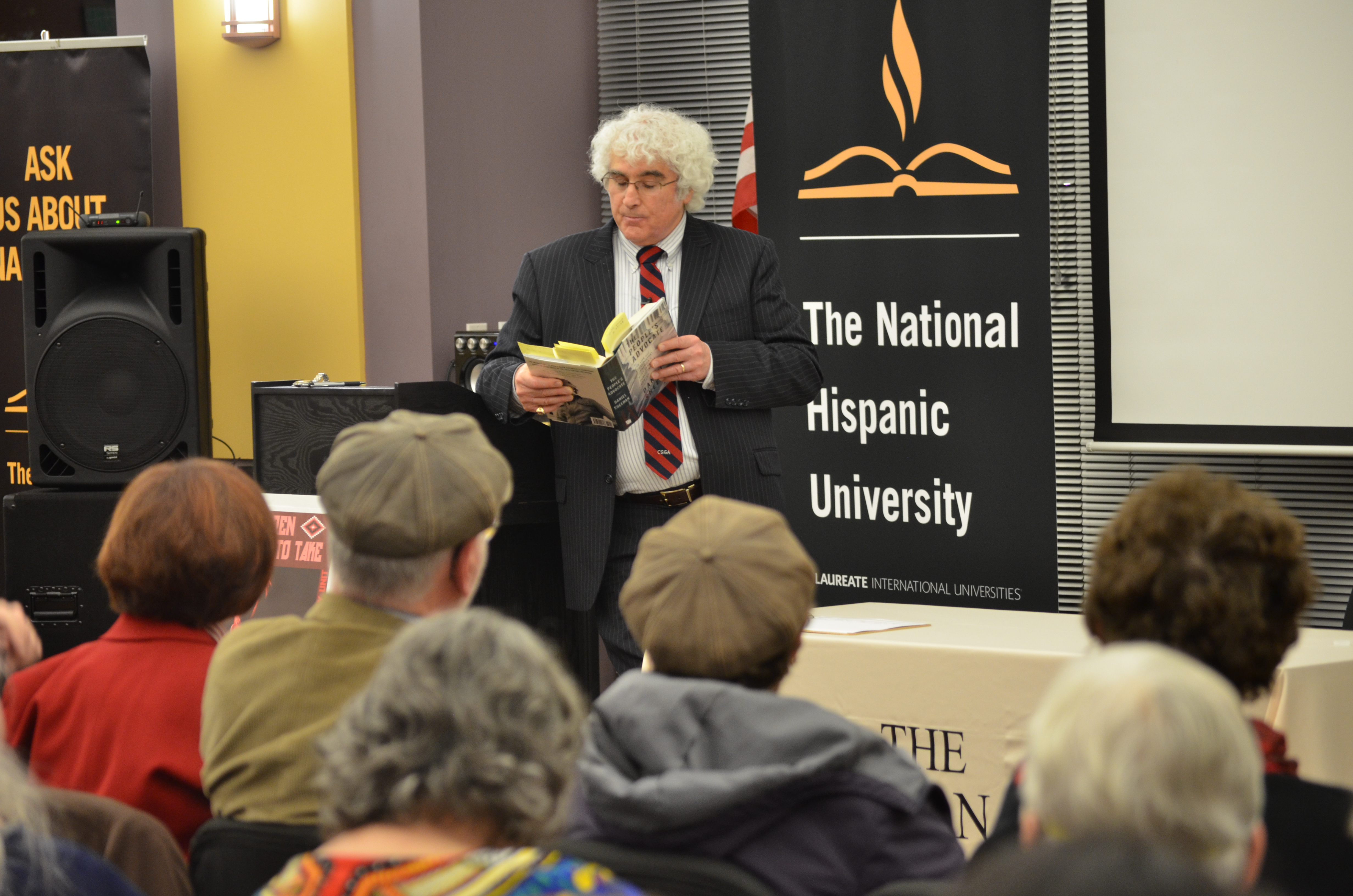 Danny Sheehan speaking at a podium